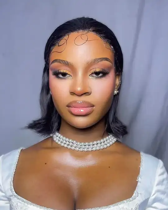 Pearl choker, laid edges and glossy rose lips