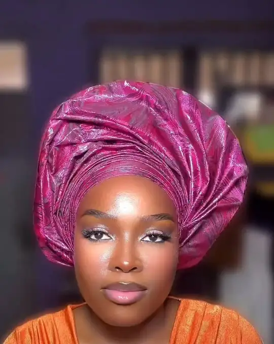 A magenta gele over orange satin, lit-from-within skin